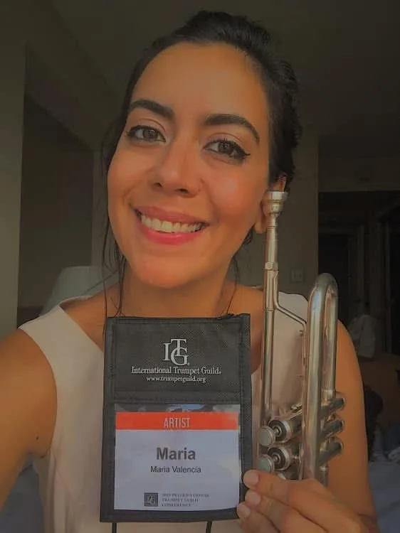 Maria Valencia holding her trumpet